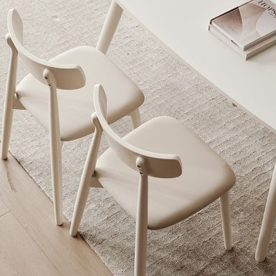 Nordic Style Dining Room Chair with Solid Wood Legs and Fabric Cover in Nitrolacquer Finish