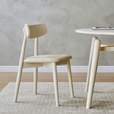 Nordic Style Dining Room Chair with Solid Wood Legs and Fabric Cover in Nitrolacquer Finish